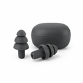Pair of charcoal silicone earplugs beside compact storage case on white background